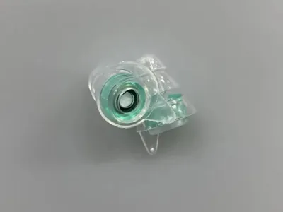 Clear Nomad earplug with green filter